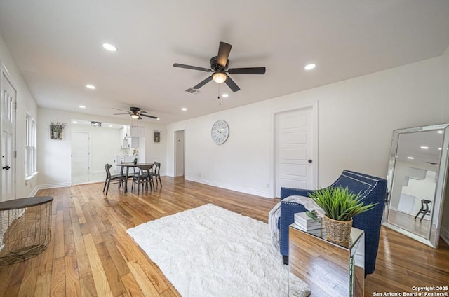 interior space featuring hardwood / wood-style floors and ceiling fan