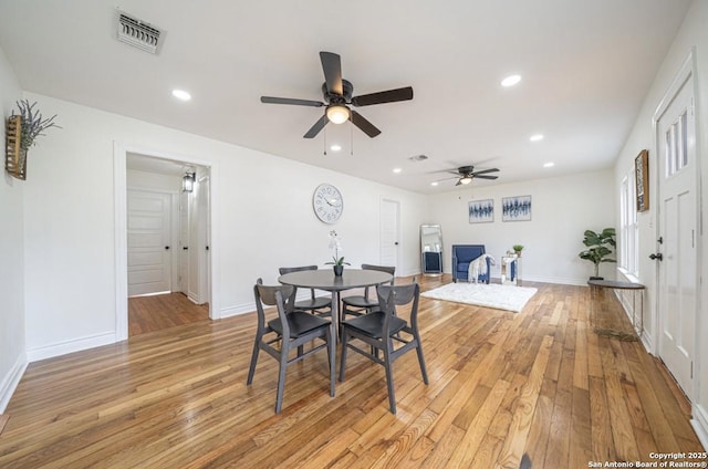 dining space with light hardwood / wood-style flooring