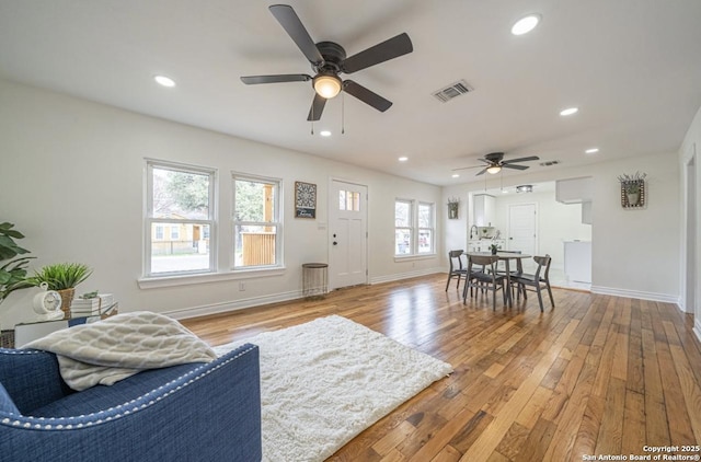 living room featuring a healthy amount of sunlight and light wood-type flooring