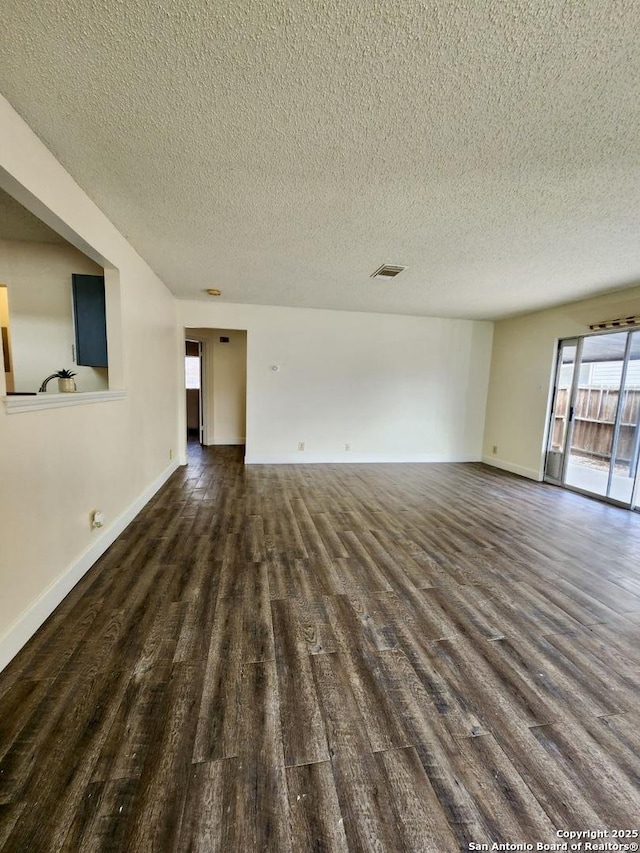 empty room with a textured ceiling