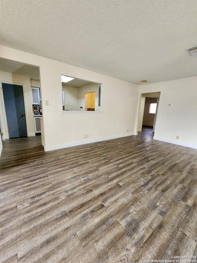 unfurnished living room with a textured ceiling