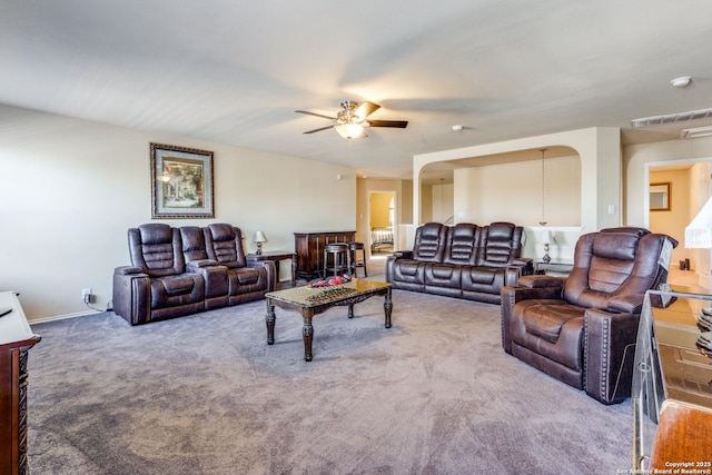 carpeted living room featuring ceiling fan