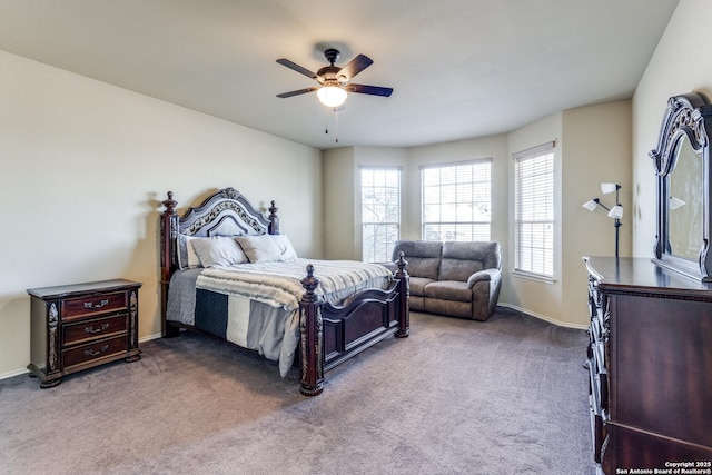 bedroom with ceiling fan and dark colored carpet