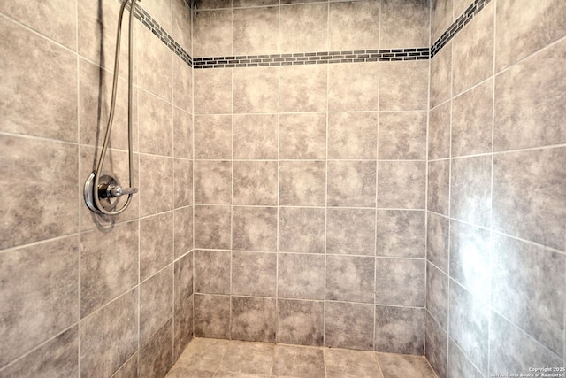 bathroom with tiled shower