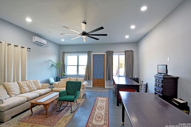 living room featuring hardwood / wood-style flooring, a wall mounted air conditioner, and ceiling fan