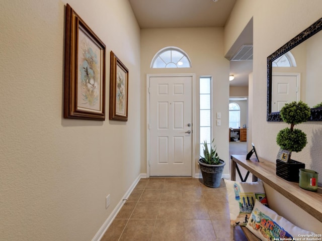 entrance foyer featuring light tile patterned floors