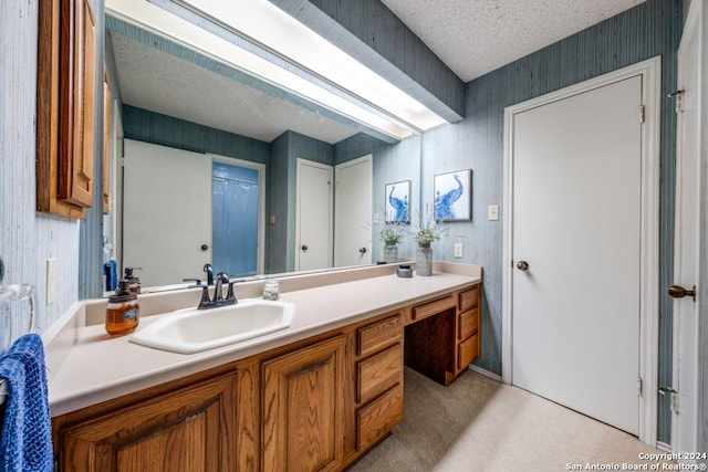 bathroom featuring vanity and a textured ceiling