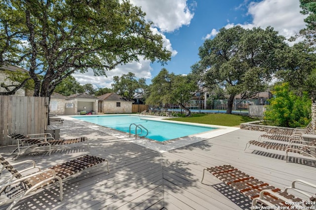 view of pool with a deck and a patio area