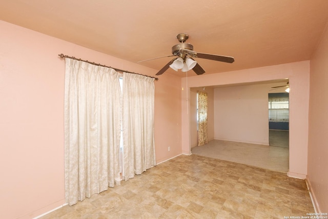 unfurnished room featuring ceiling fan