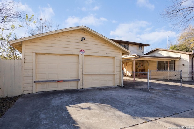 view of front of home with a garage and an outdoor structure