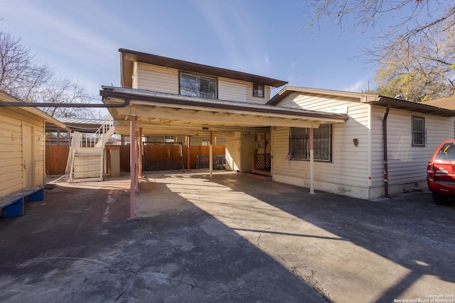 view of front of property featuring a carport