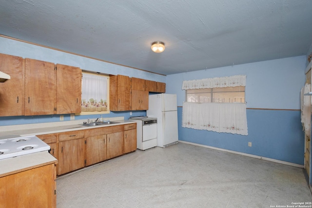 kitchen with sink and white appliances