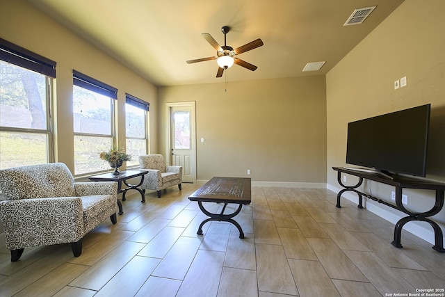 sitting room featuring ceiling fan