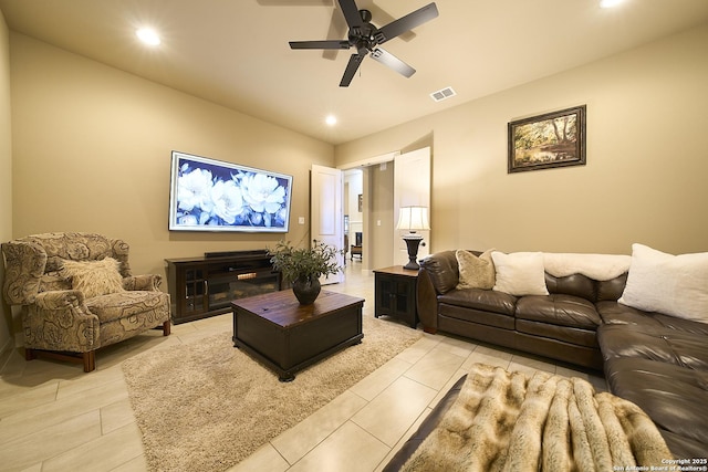 living room with light tile patterned floors and ceiling fan