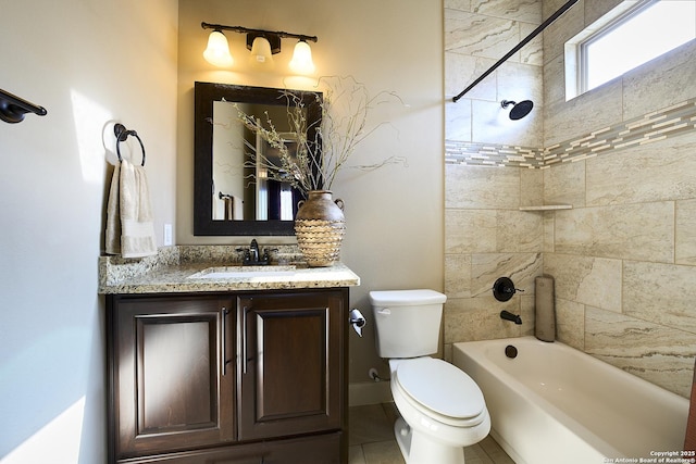 full bathroom featuring vanity, tiled shower / bath combo, and toilet