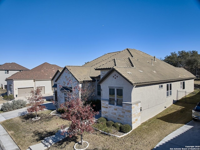 view of front of property featuring a garage and a front yard