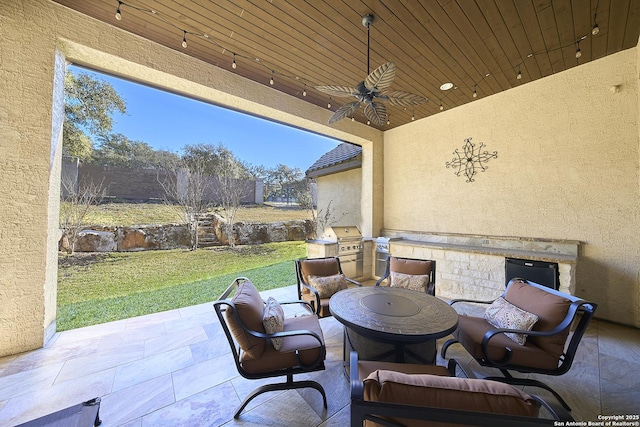 view of patio / terrace with ceiling fan and grilling area