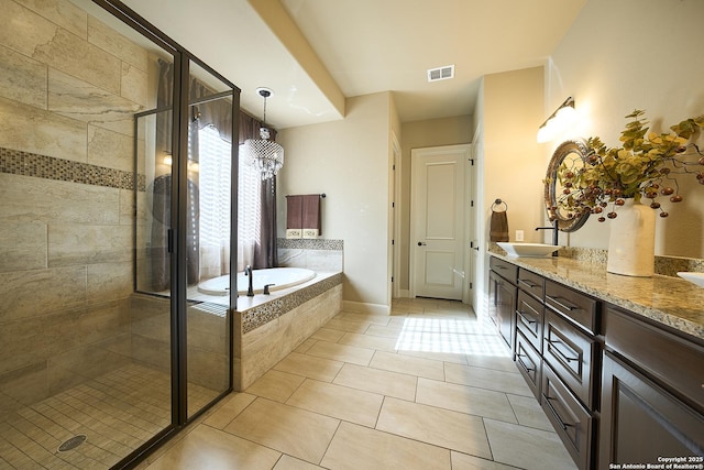 bathroom with vanity, separate shower and tub, and tile patterned floors