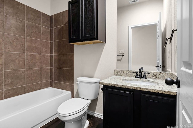 full bathroom with shower / bathtub combination, vanity, and toilet