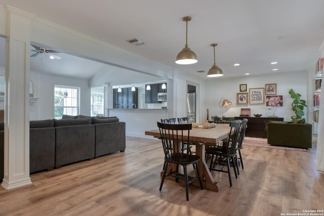 dining room featuring light wood finished floors, visible vents, ceiling fan, ornamental molding, and recessed lighting