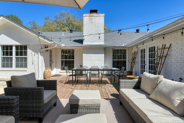 view of patio / terrace featuring an outdoor hangout area, french doors, and outdoor dining space