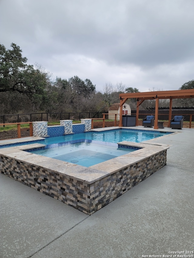 view of swimming pool featuring an in ground hot tub and a patio