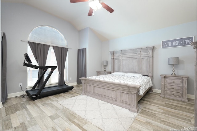 bedroom with vaulted ceiling, light hardwood / wood-style floors, and ceiling fan