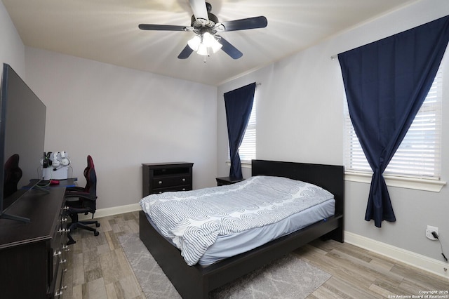 bedroom featuring wood-type flooring and ceiling fan