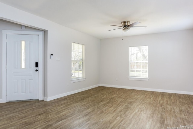 entryway with hardwood / wood-style floors and ceiling fan