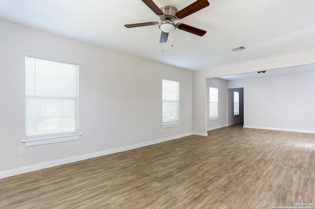 unfurnished room featuring ceiling fan and light hardwood / wood-style floors