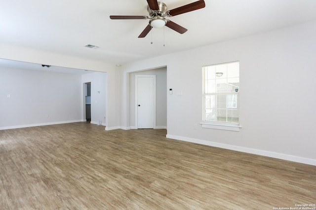 unfurnished room featuring ceiling fan and light wood-type flooring