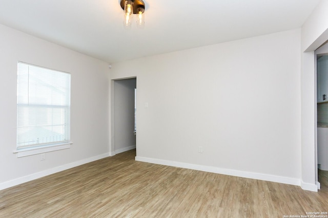 spare room with light hardwood / wood-style floors