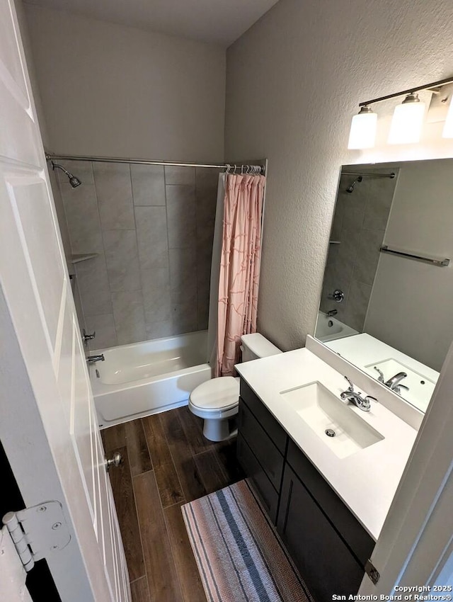 full bathroom with vanity, toilet, and shower / bath combo with shower curtain