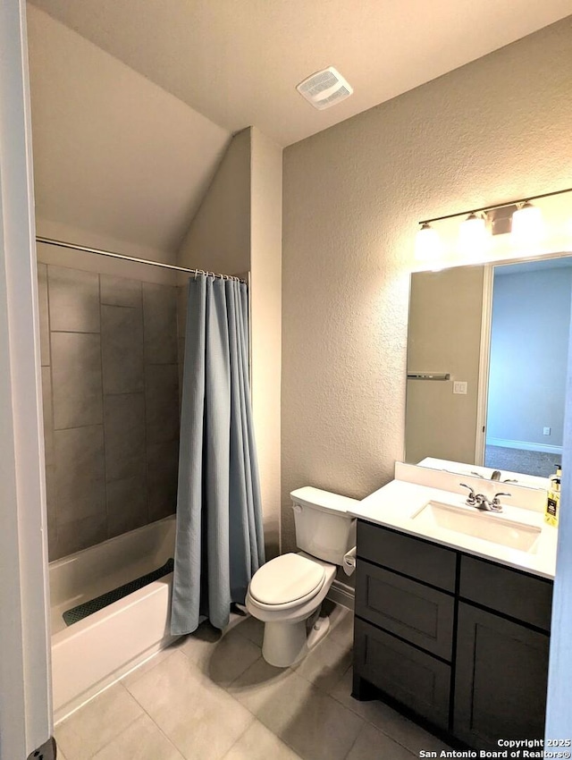 full bathroom with lofted ceiling, tile patterned floors, toilet, shower / tub combo, and vanity