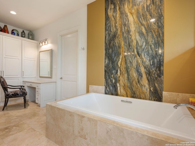 bathroom featuring tiled bath