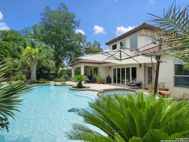 view of swimming pool with a patio area