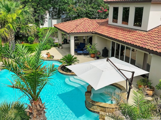 view of swimming pool featuring a patio