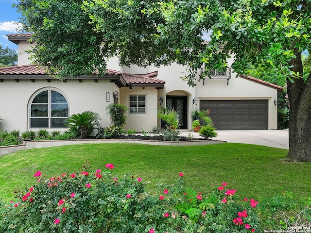 mediterranean / spanish-style home with a front lawn