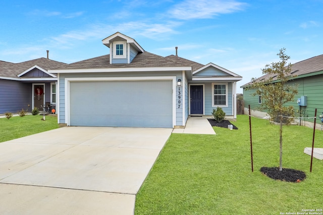 view of front of house with a garage and a front lawn