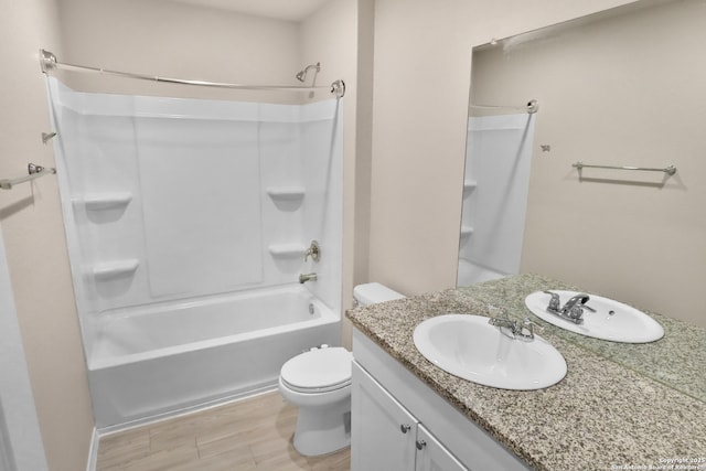 full bathroom featuring vanity, hardwood / wood-style floors,  shower combination, and toilet