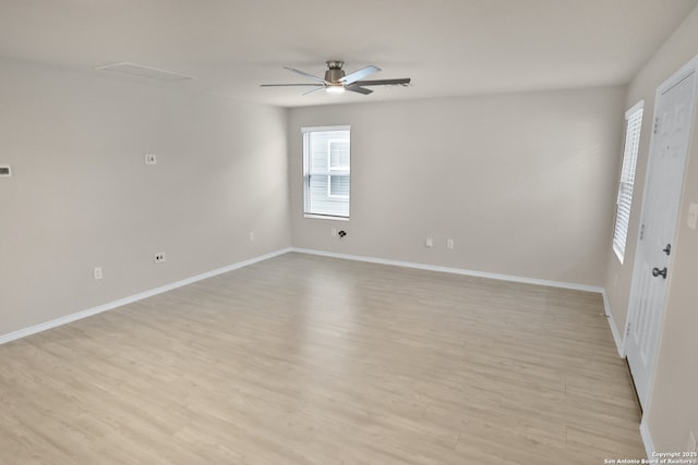 spare room featuring light hardwood / wood-style flooring and ceiling fan