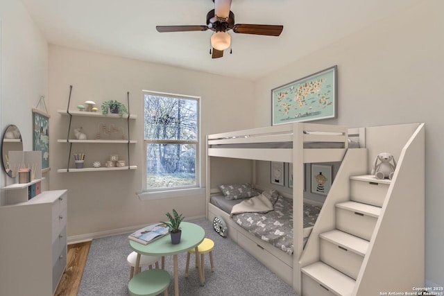 bedroom with hardwood / wood-style flooring and ceiling fan