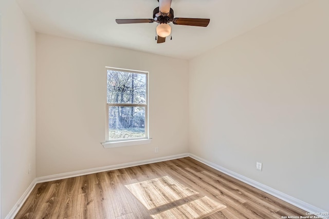 unfurnished room featuring ceiling fan and light wood-type flooring