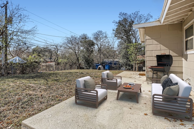 view of yard with an outdoor living space with a fireplace and a patio area