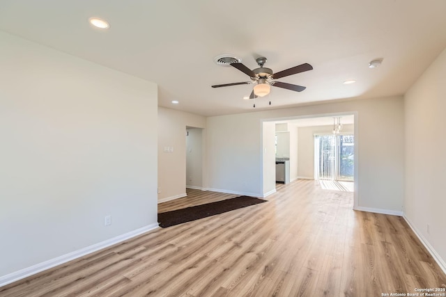 spare room featuring ceiling fan and light wood-type flooring