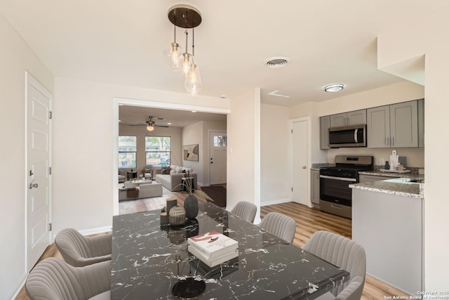 dining area with light hardwood / wood-style flooring