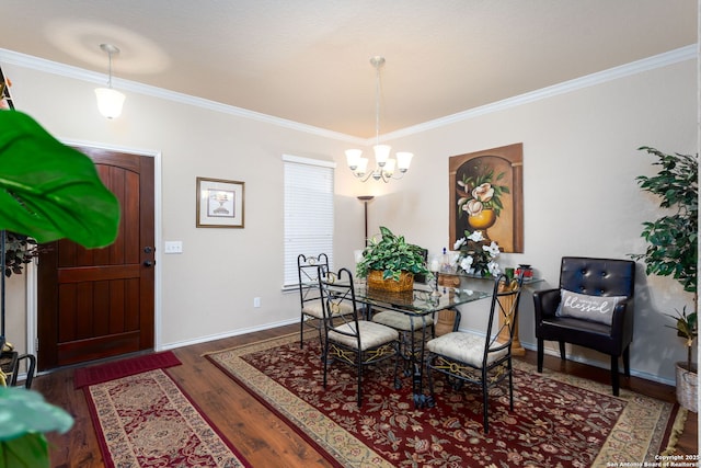 dining area with crown molding, dark hardwood / wood-style flooring, and a notable chandelier