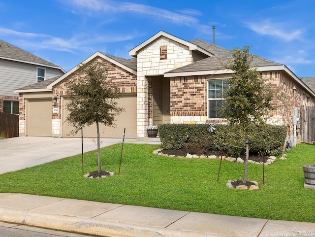 view of front of property with a garage and a front lawn