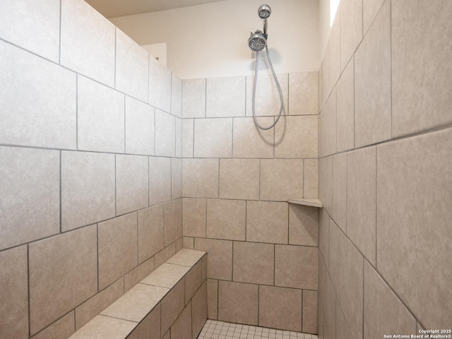 bathroom with tiled shower