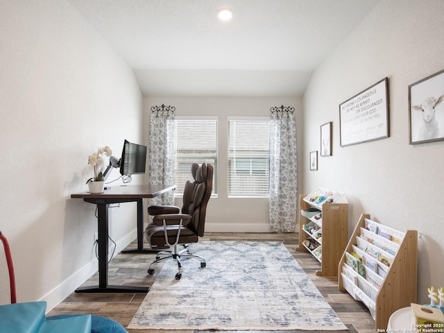 office area with lofted ceiling and dark wood-type flooring